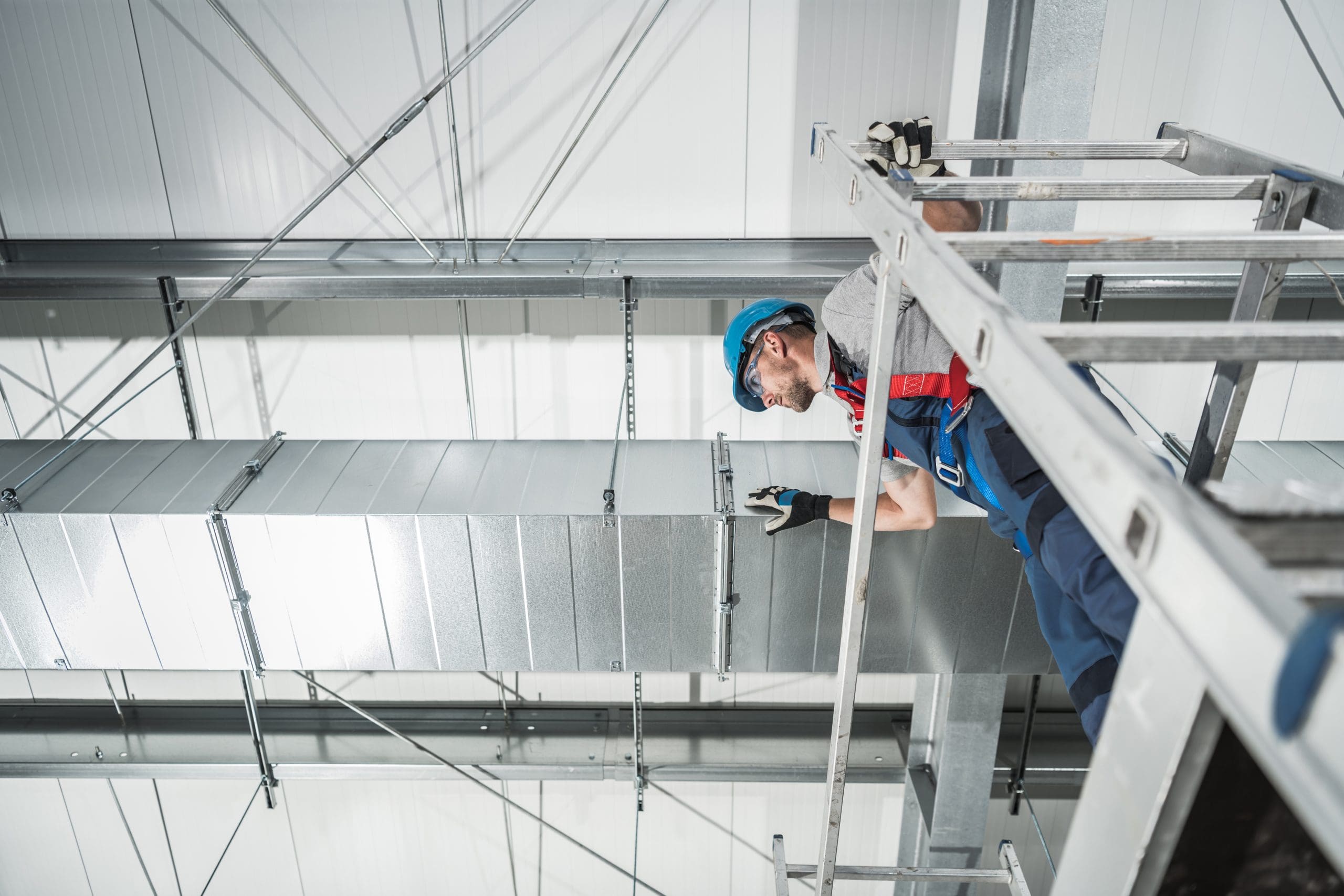 HVAC Air Quality Technologies Technician Finishing Project. Looking From Scaffolding on the Air Shaft. Heating and Cooling.